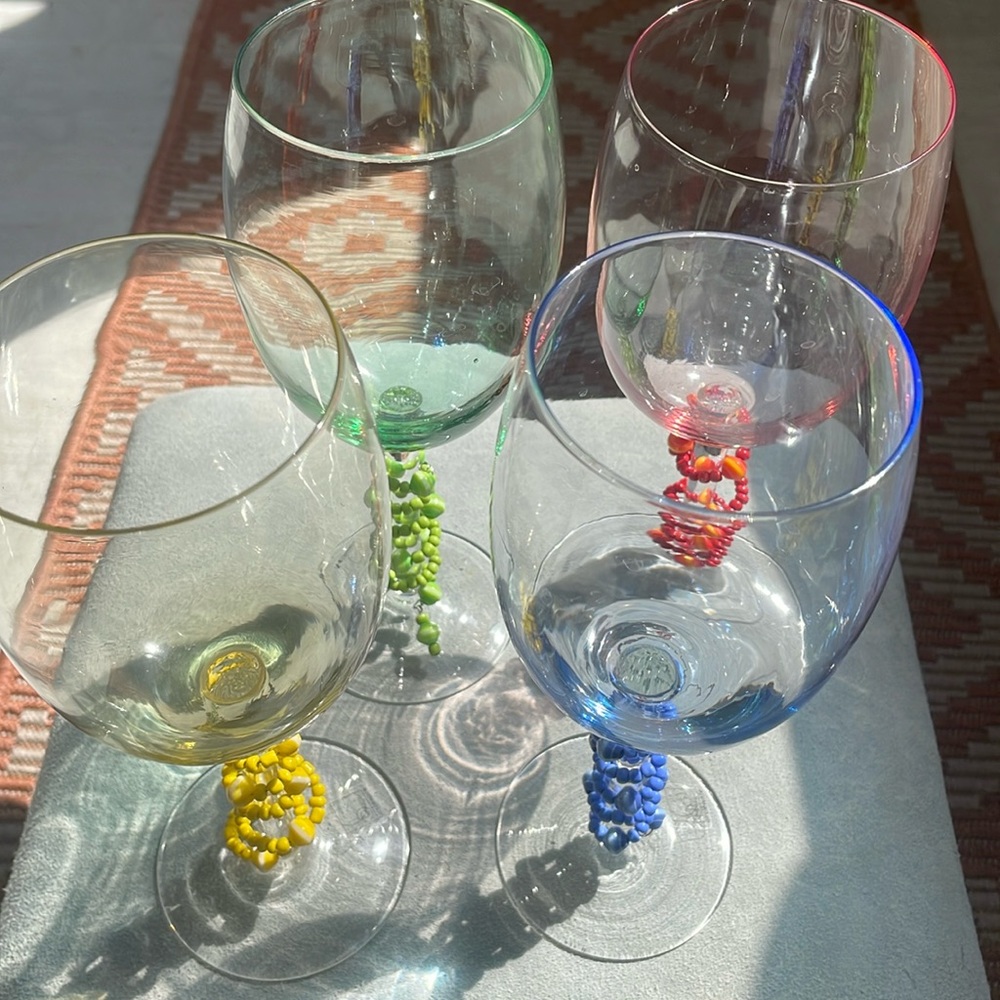 Set of colored wine glasses with colored beads